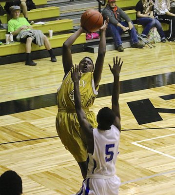 Image: JV Gladiator Anthony Lusk(4) goes up for two of his 5-points against Gateway.