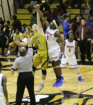 Image: Italy’s senior center Cody Boyd(4) challenges Gateway for control of the opening tip to start the varsity matchup.