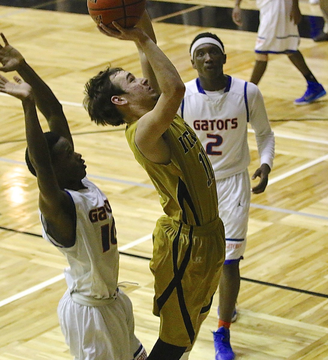 Image: Gladiator Ryan Connor(11) goes up strong for 2-points against the Gators.