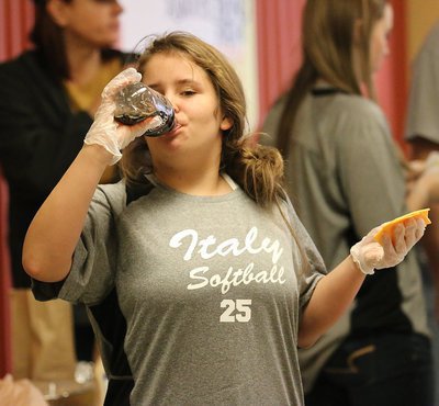 Image: Lady Gladiator softball player Jillian Varner takes a well deserved break from serving up burgers.