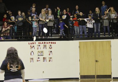 Image: Fans participate in the Tortilla Toss sponsored by the Lady Gladiator Softball team as a fundraiser.
