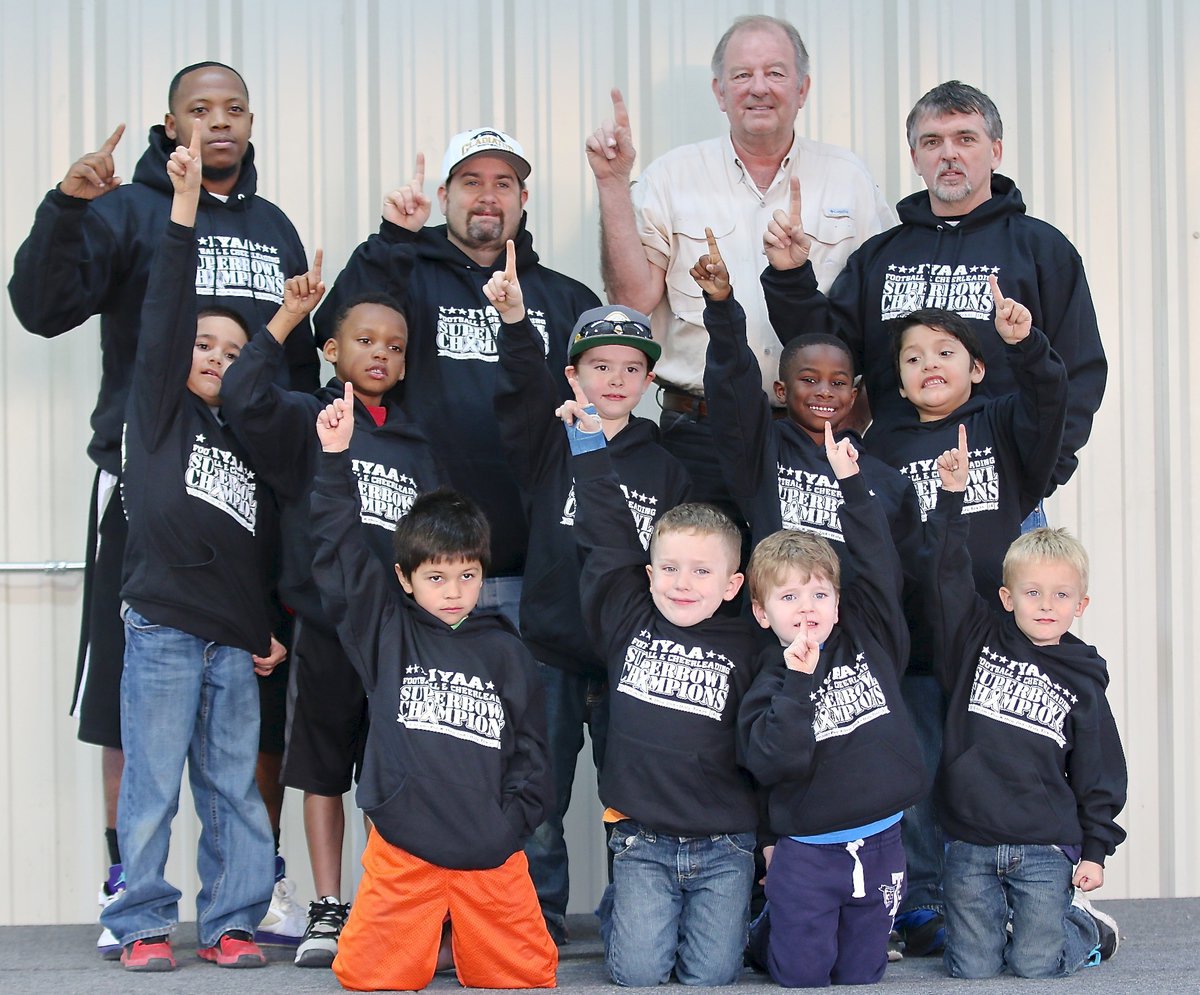 Image: Representing the IYAA C-team 2014 NEH (Navarro, Ellis, Hill) Superbowl Champion Gladiators are (back row): Special teams coach Andre Speed, line coach Barry Byers, City of Italy’s Mayor James Hobbs, and offensive coordinator Gary Wood. (Middle row): Damian Wooldridge, Curtis Benson, Gared Wood, Elijah Davis and Gavin Vasquez. (Front row): Ramzi Holt, Grant Morgan, J.C. Smith and Kace McDaniel.
    Not pictured are head coach Jasenio Anderson, defensive coordinator Shedric Walker and players “Lucky” Johnson, Ryland Cagle, Jayden Hernandez and Koda Harris.