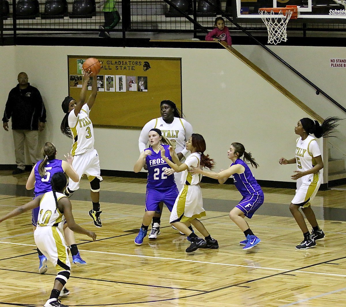 Image: With the game now tied 62-62 with 0:05 on the clock, Lady Gladiator Kortnei Johnson(3) clutches a missed free-throw by Frost and then races up the court in the final four seconds hoping to get off a potentially game-winning shot.