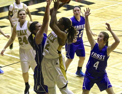 Image: Lady Gladiator Emmy Cunningham(2) attacks Frost off the dribble.