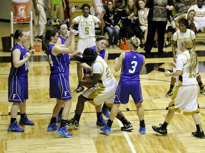 Image: Taleyia Wilson(22) turns a rebound into a war to let Frost know this is her lane and this is our dome.