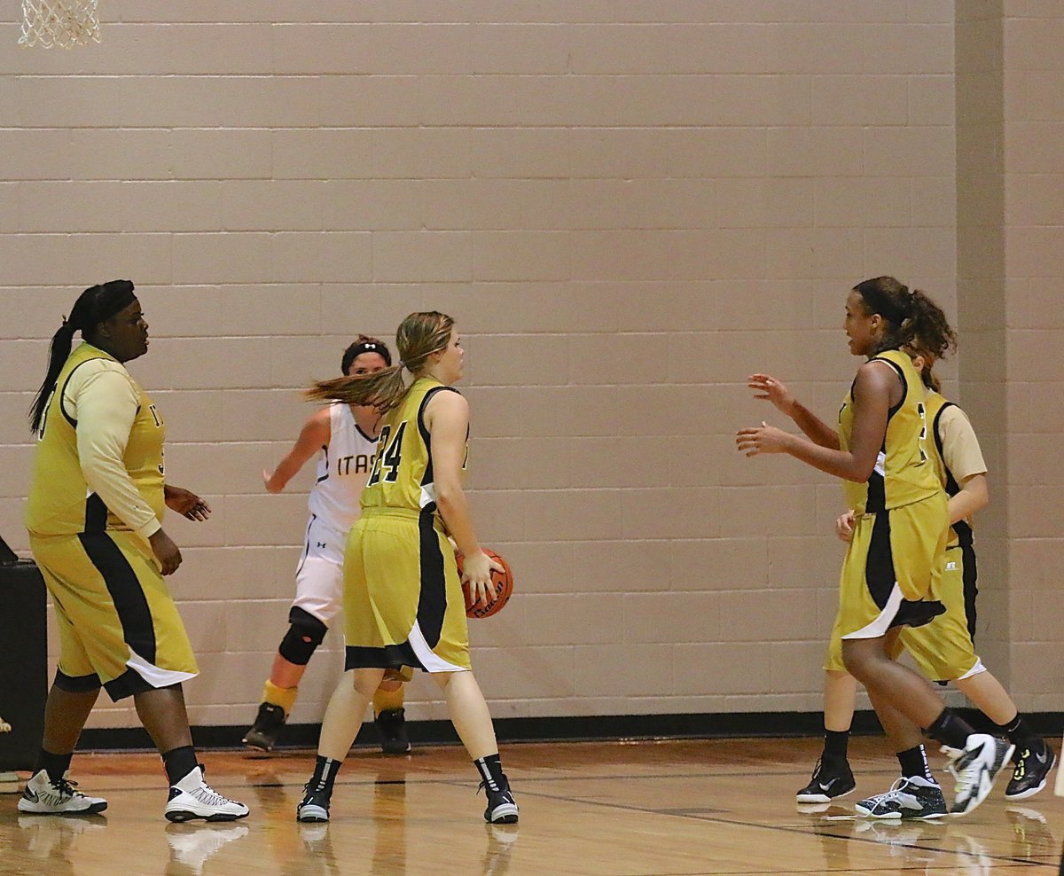 Image: Lady Gladiator Lillie Perry(24) collects a rebound and then passes out to teammate Emmy Cunningham(2).