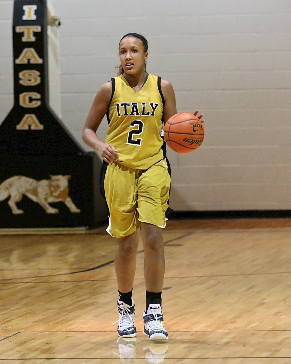 Image: Emmy Cunningham(2) brings the ball up the court for Italy.