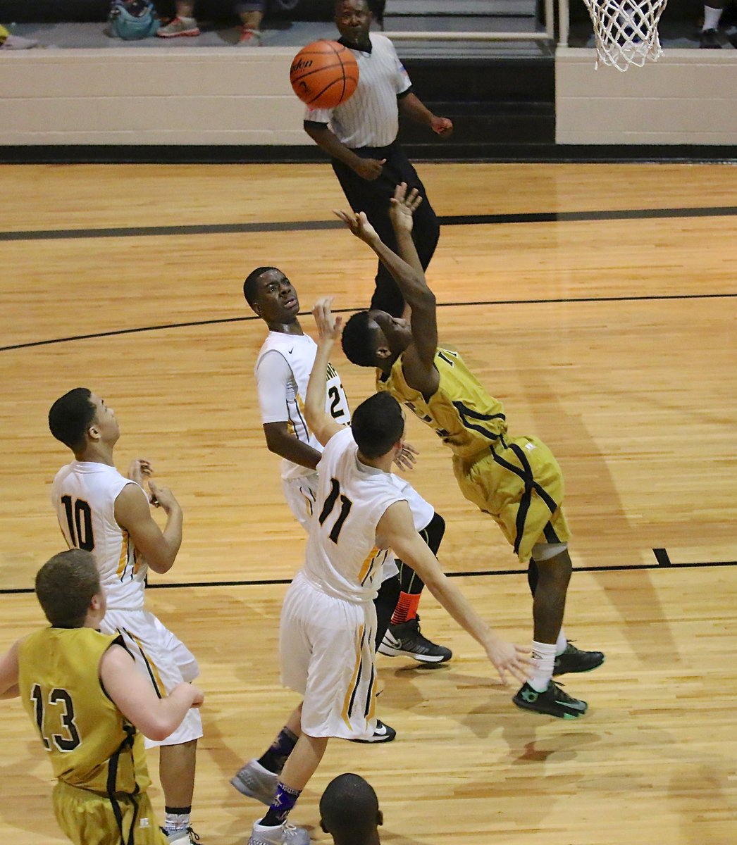 Image: Gladiator point guard Kevin Johnson(5) gets fouled by Itasca on his way to the basket. The game was close until the last minutes when the Wampus Cats finally pulled away to win by 6-points, 53-47.