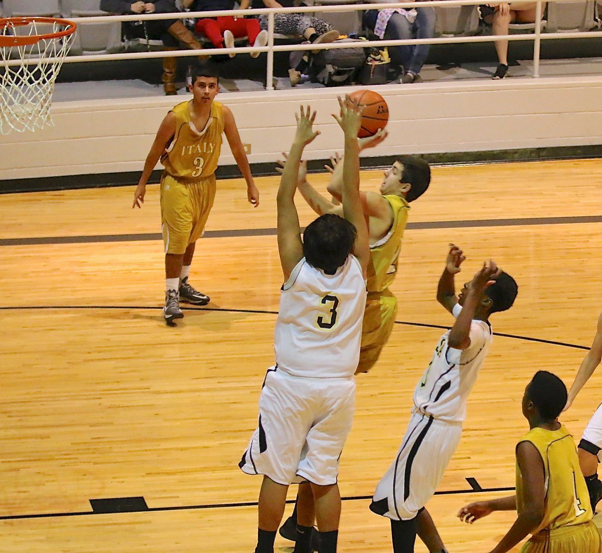 Image: Gary Escamilla(2) powers his way to the basket for Italy’s JV Gladiators.