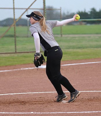 Image: Senior Lady Gladiator pitcher Jaclynn Lewis(15) handled the Lady Hawk hitters masterfully to get the 2015 season off on the right foot.