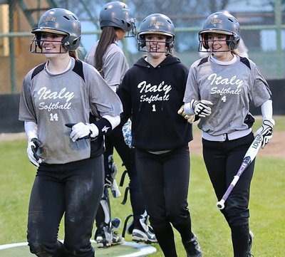 Image: Kelsey Nelson(14), Bailey Eubank(1) and Britney Chambers(4) all score after Jaclynn Lewis hit her 3-run double.
