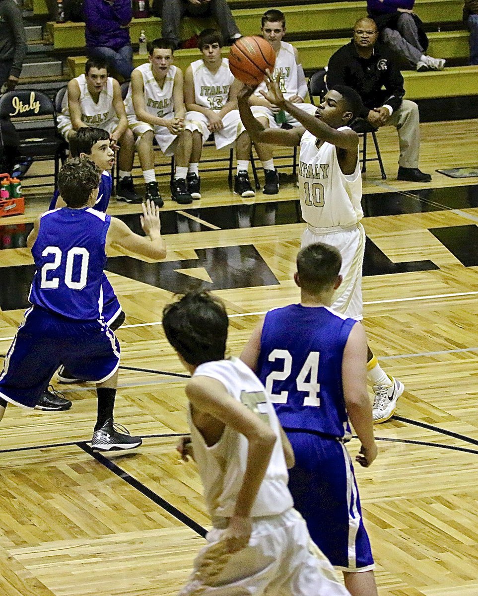 Image: JV Gladiator Byron Lusk, Jr.(10) takes the jumper without hesitation.