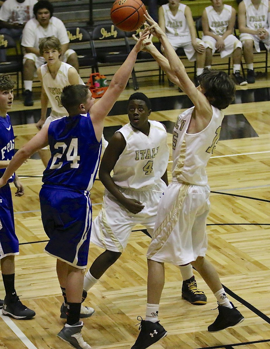 Image: JV Gladiator Ty Hamilton(15) shoots over a Frost defender.