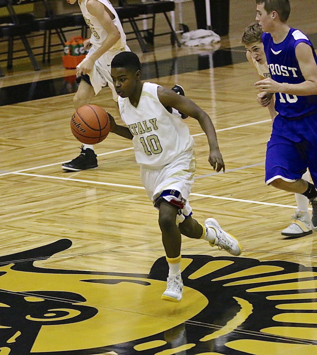 Image: Byron Lusk, Jr.(10) hurries the ball across mid court for Italy’s JV.