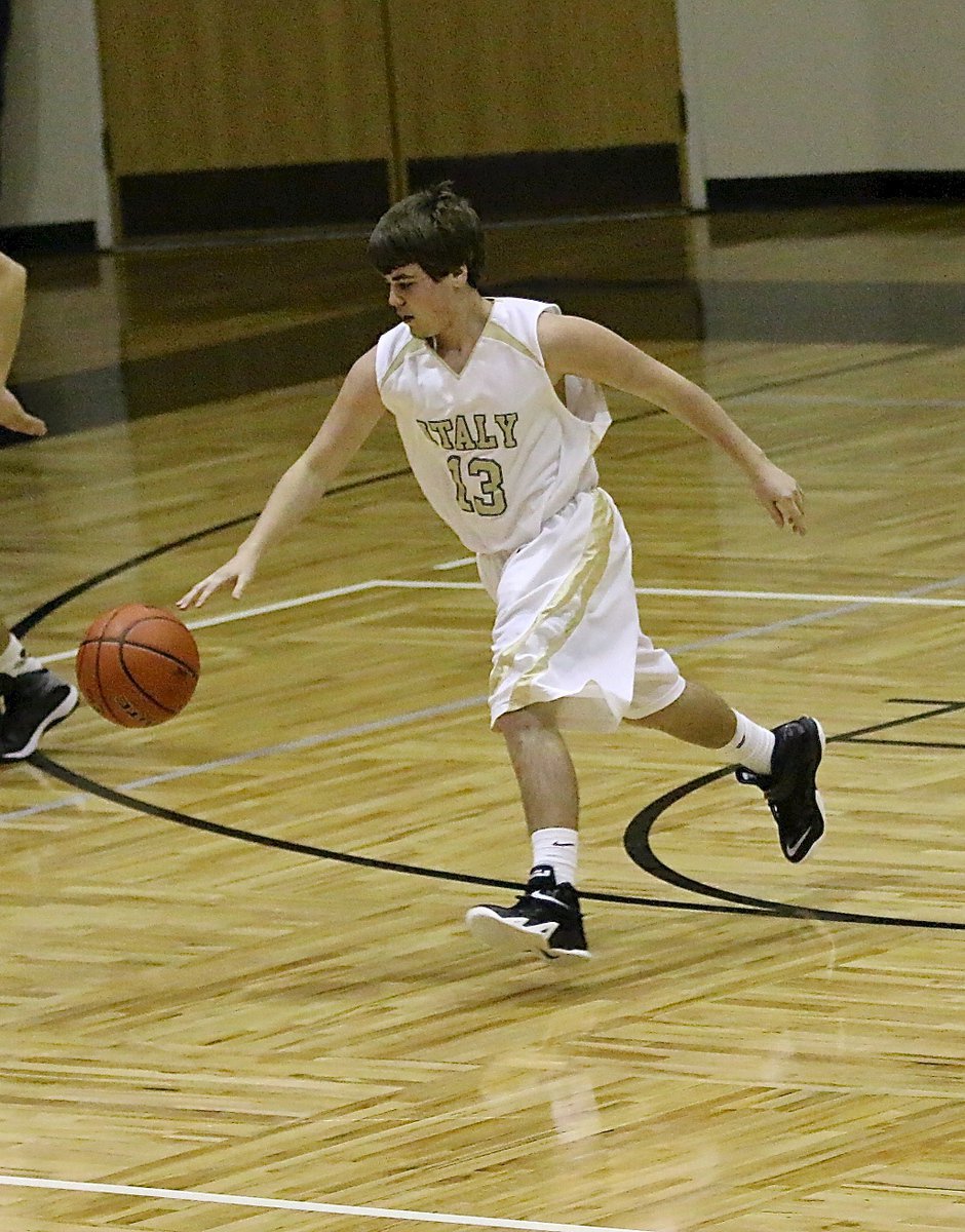 Image: JV Gladiator Cade Roberts(13) controls a rebound on the defensive end.