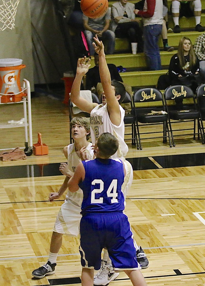 Image: JV Gladiator Gary Escamilla(2) puts up a shot from the low block.