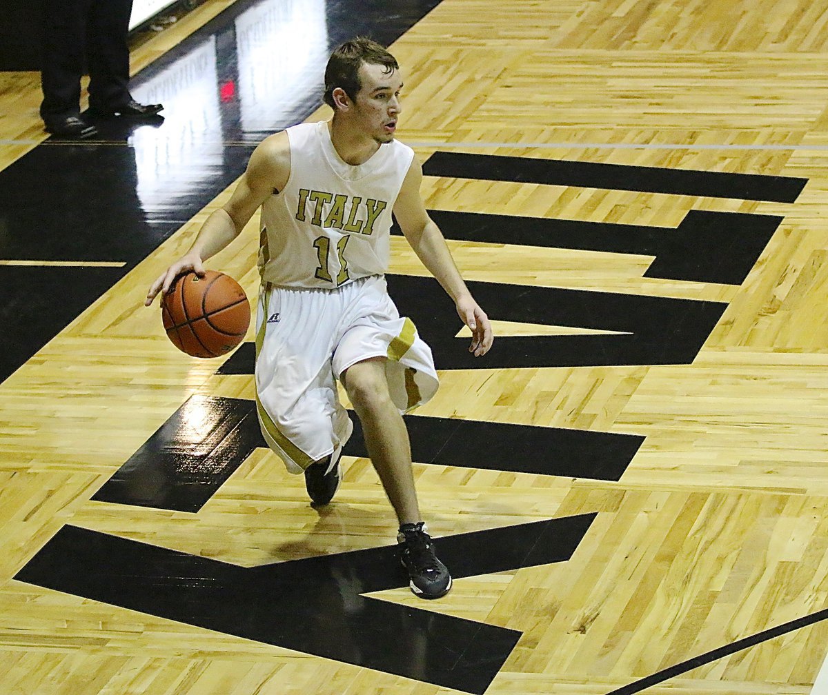 Image: Gladiator Ryan Connor(11) brings the ball up court for you guessed it, Italy!"