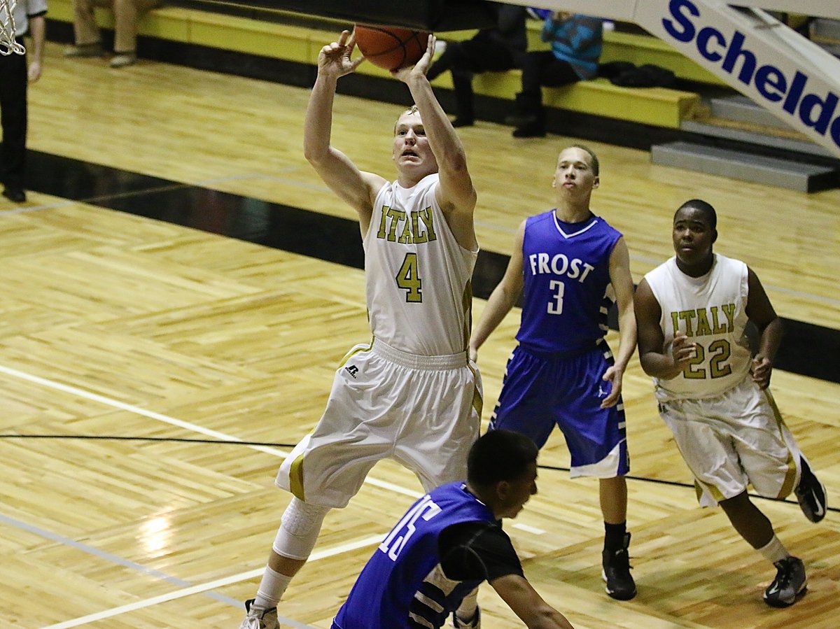 Image: High-flying Gladiator senior Cody Boyd(4) leaps high for this bucket against Frost. Boyd finished with his jersey number in points.