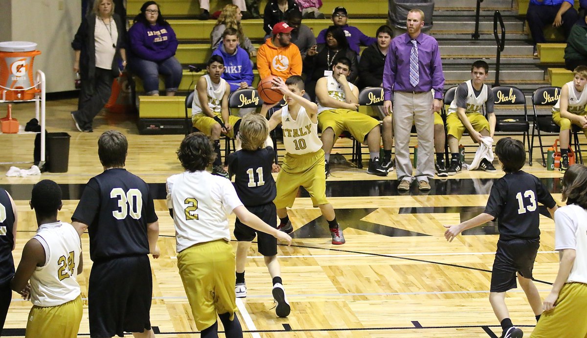 Image: Brentlee Grant(10) finishes his junior high career with a swishing three-pointer to beat the buzzer.