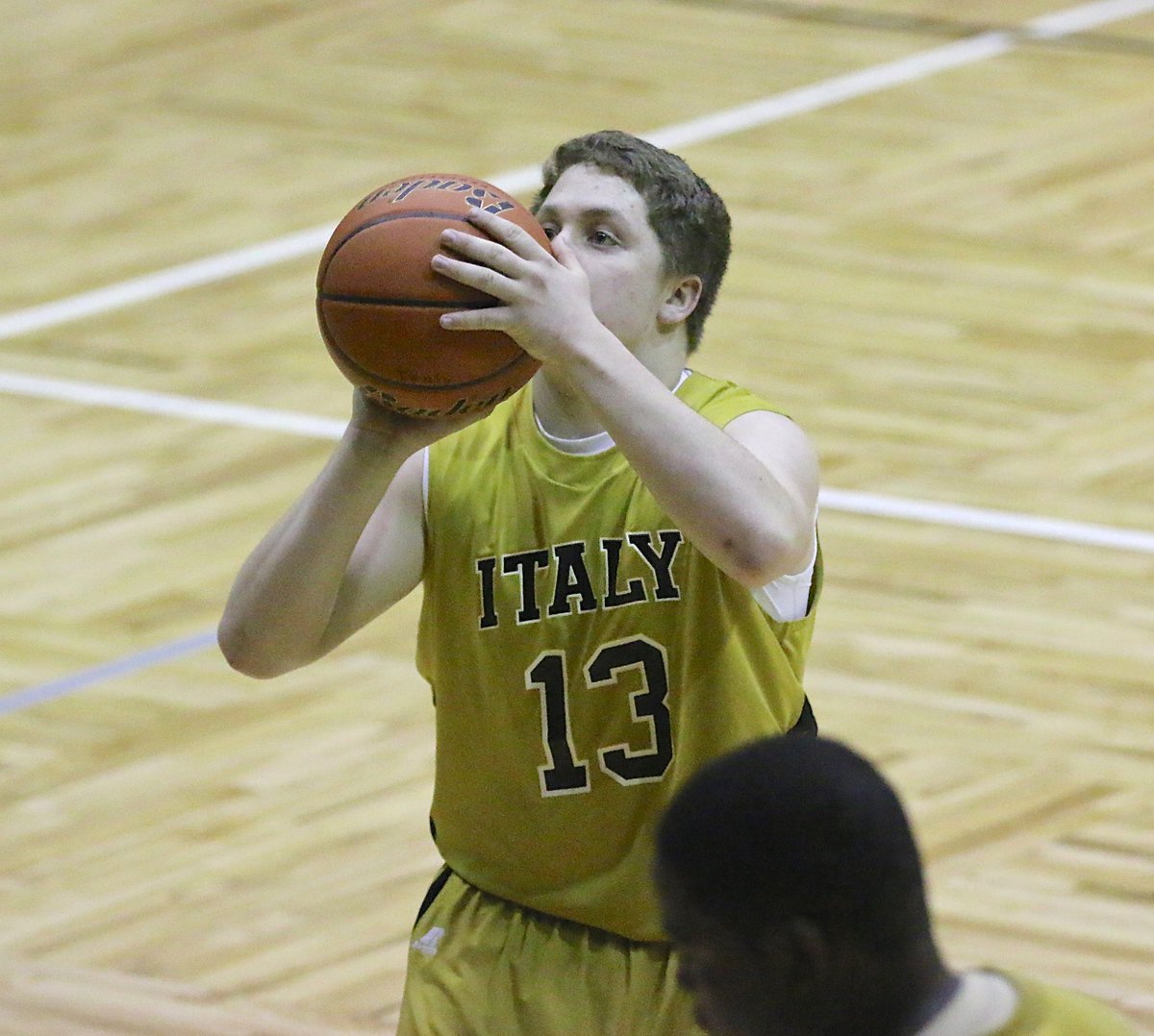 Image: Italy senior guard John Escamilla(13) takes advantage of a free-throw opportunity against Garland Alpha Charter.