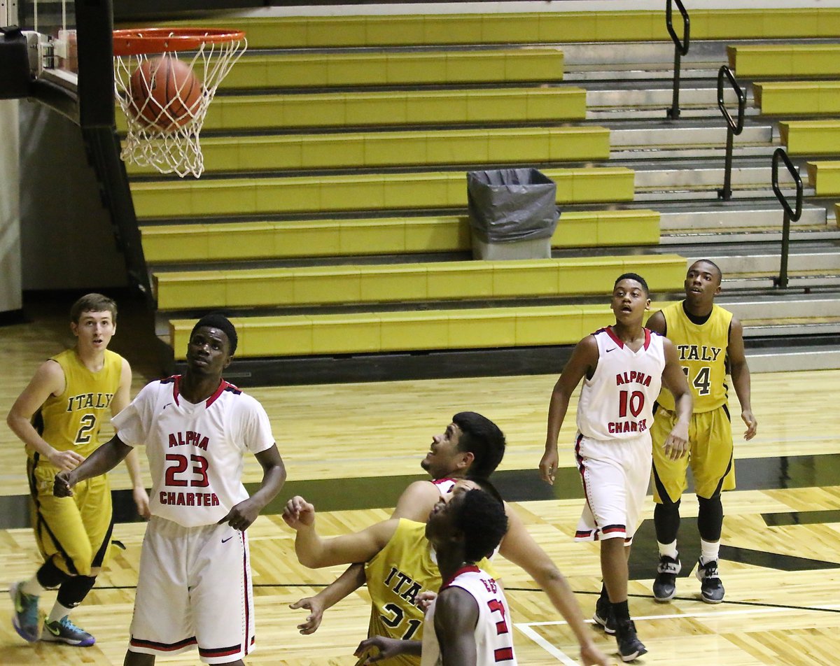 Image: Italy’s Kendrick Norwood(14) watches his three-ball drop clean thru the rim.