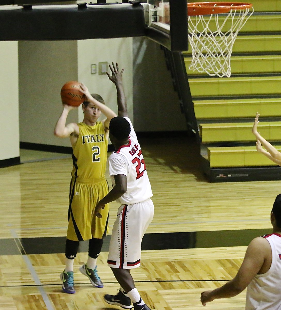 Image: Gladiator Gary Kincaid(2) knocks down a corner jumper over a Garland Alpha Charter defender.