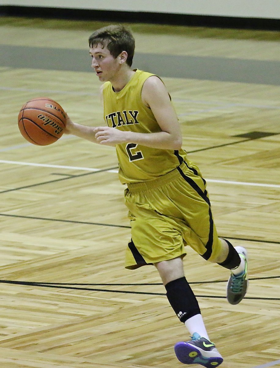 Image: Gladiator Gary Kincaid(2) pushes the ball up the court to keep Garland Alpha Charter’s defense on its heels.