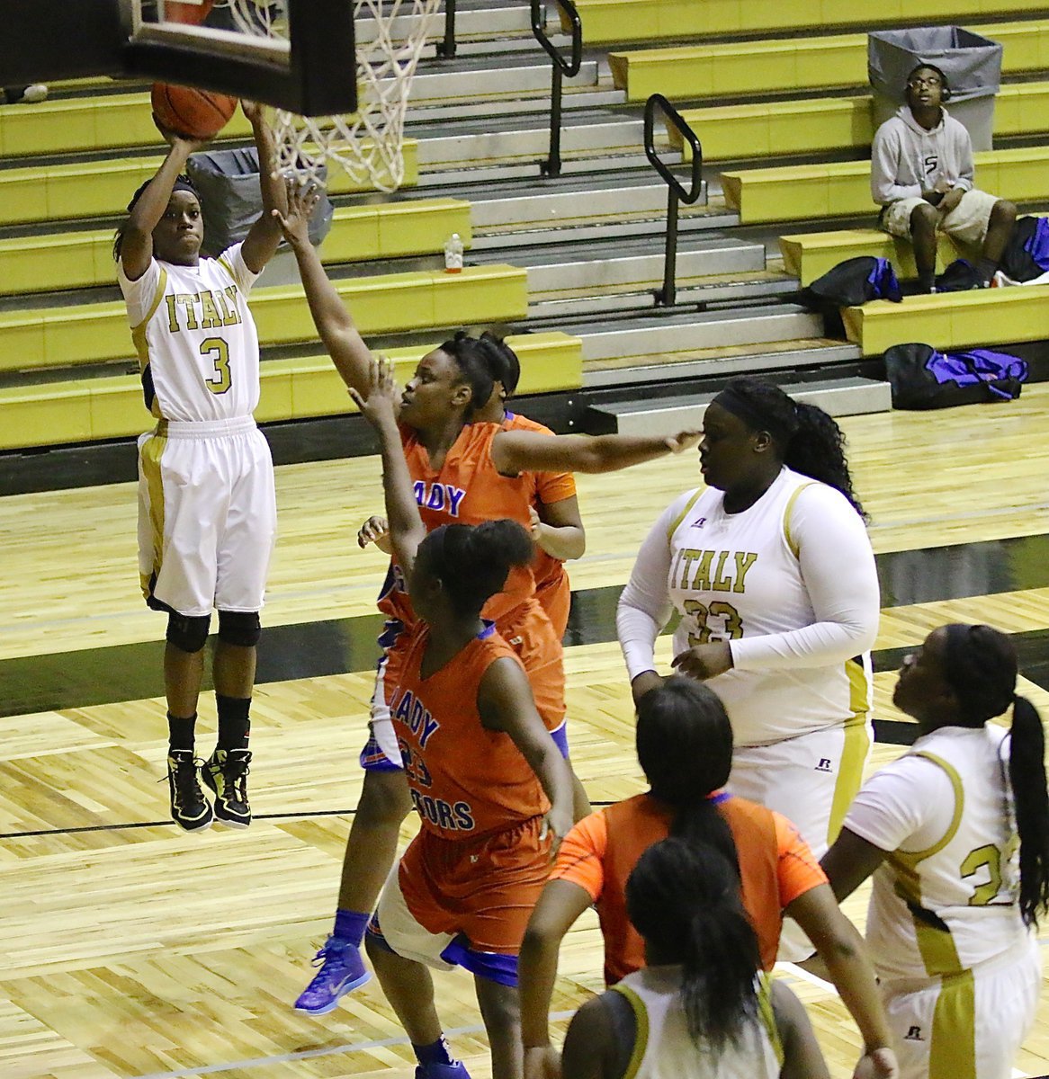 Image: Senior Kortnei Johnson(3) tries a baseline shot as teammates Cory Chance(33), Taleyia Wilson(22) and K’Breona Davis(10) move into rebounding position for the Lady Gladiators during 2015 Senior Night.