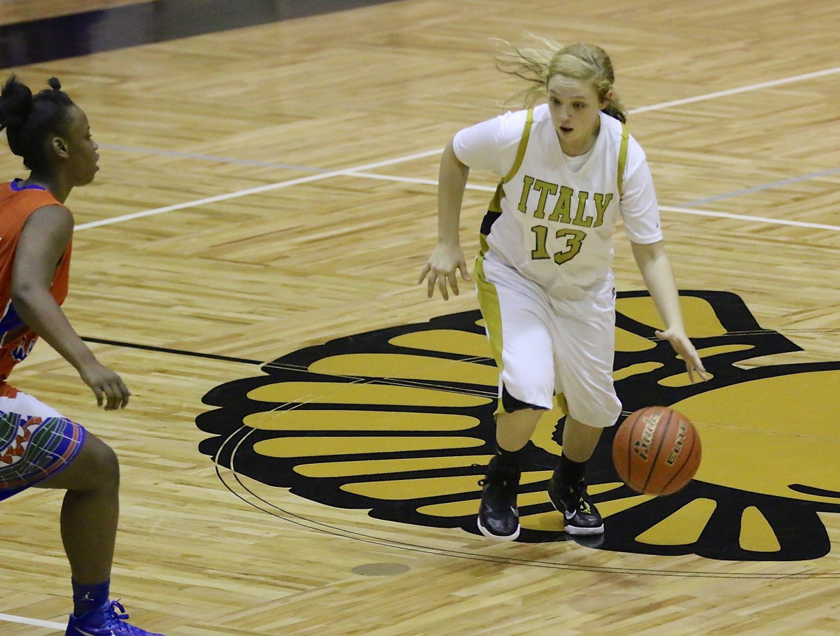 Image: Freshman guard Brycelen Richards(13) works the ball across mid court for the Lady Gladiators.