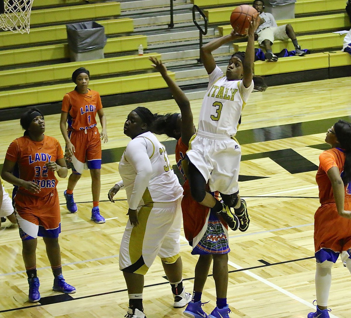 Image: Lady Gladiator Kortnei Johnson(3) splits Gateway defenders to get to the rim with teammate Cory Chance(33) ready to rebound.