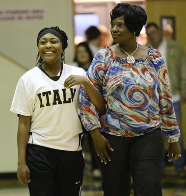 Image: Lady Gladiator senior K’Breona Davis(10) is honored at halftime during 2015 Senior Night while being escorted by her grandmother Kimberly Cook.