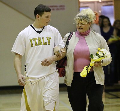 Image: Senior Gladiator Coby Jeffords(3) is honored during 2015 Senior Night inside Italy Coliseum. Coby is escorted by his mother Micki Howard Bland.
