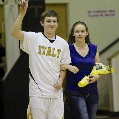 Image: Senior Gladiator Gary Kinkaid(2) is honored during 2015 Senior Night inside Italy Coliseum. Gary is escorted by his mother Chasity Collier.