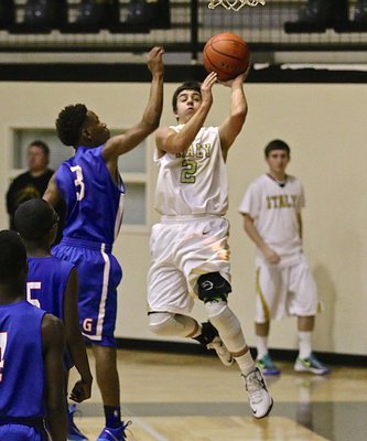 Image: Gary Escamilla(2) drives to the hoop for Italy’s JV Gladiators.