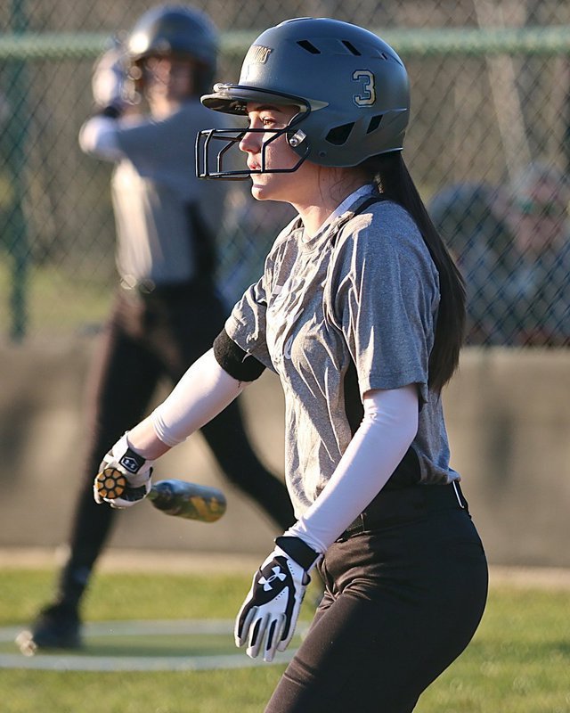 Image: Lady Gladiator Cassidy Childers(3) slaps the ball into play and then reaches first-base safely.