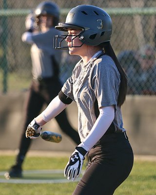 Image: Lady Gladiator Cassidy Childers(3) slaps the ball into play and then reaches first-base safely.
