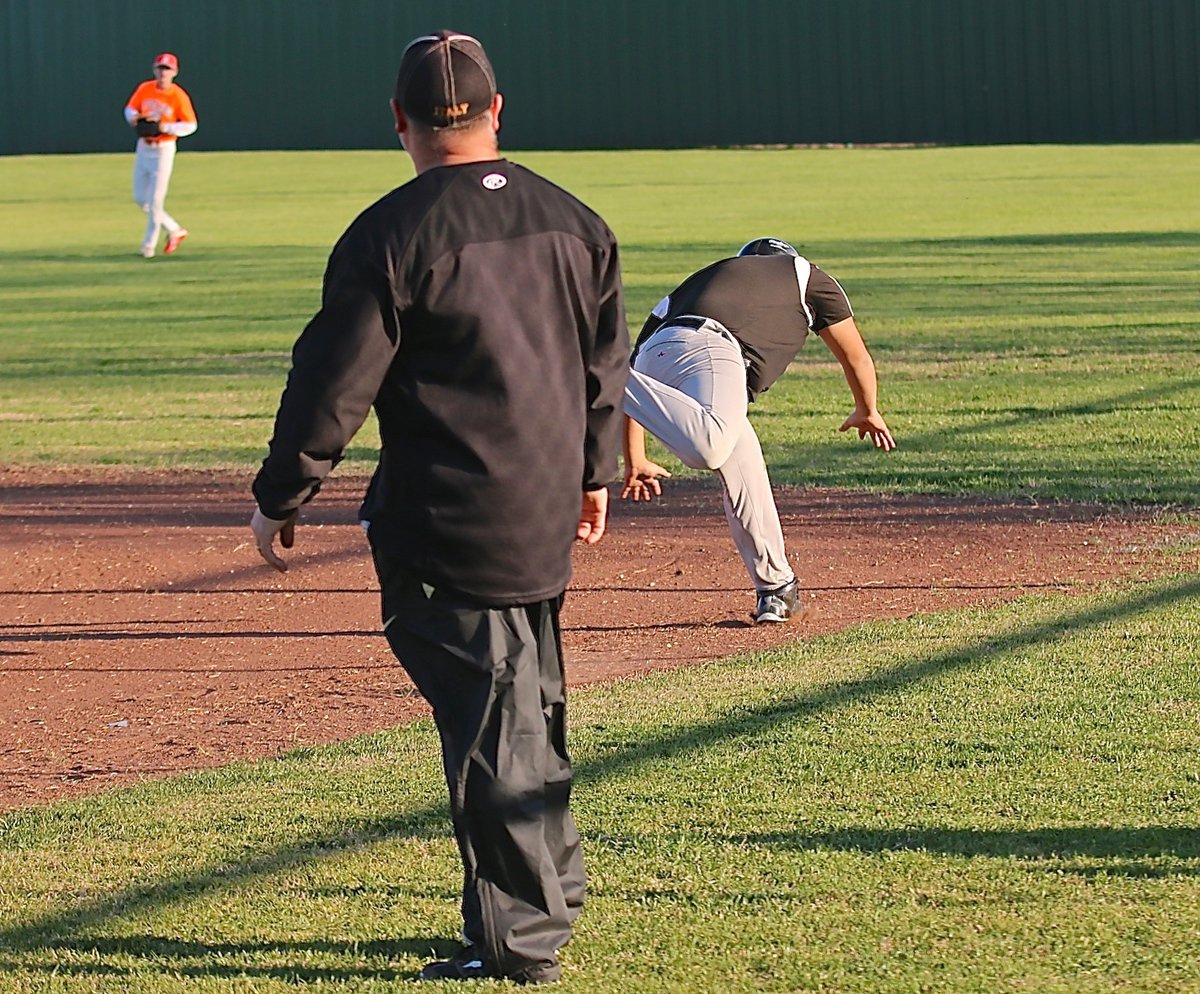 Image: Italy’s Pedro Salazar dives into the 2015 season head first after reaching first-base.