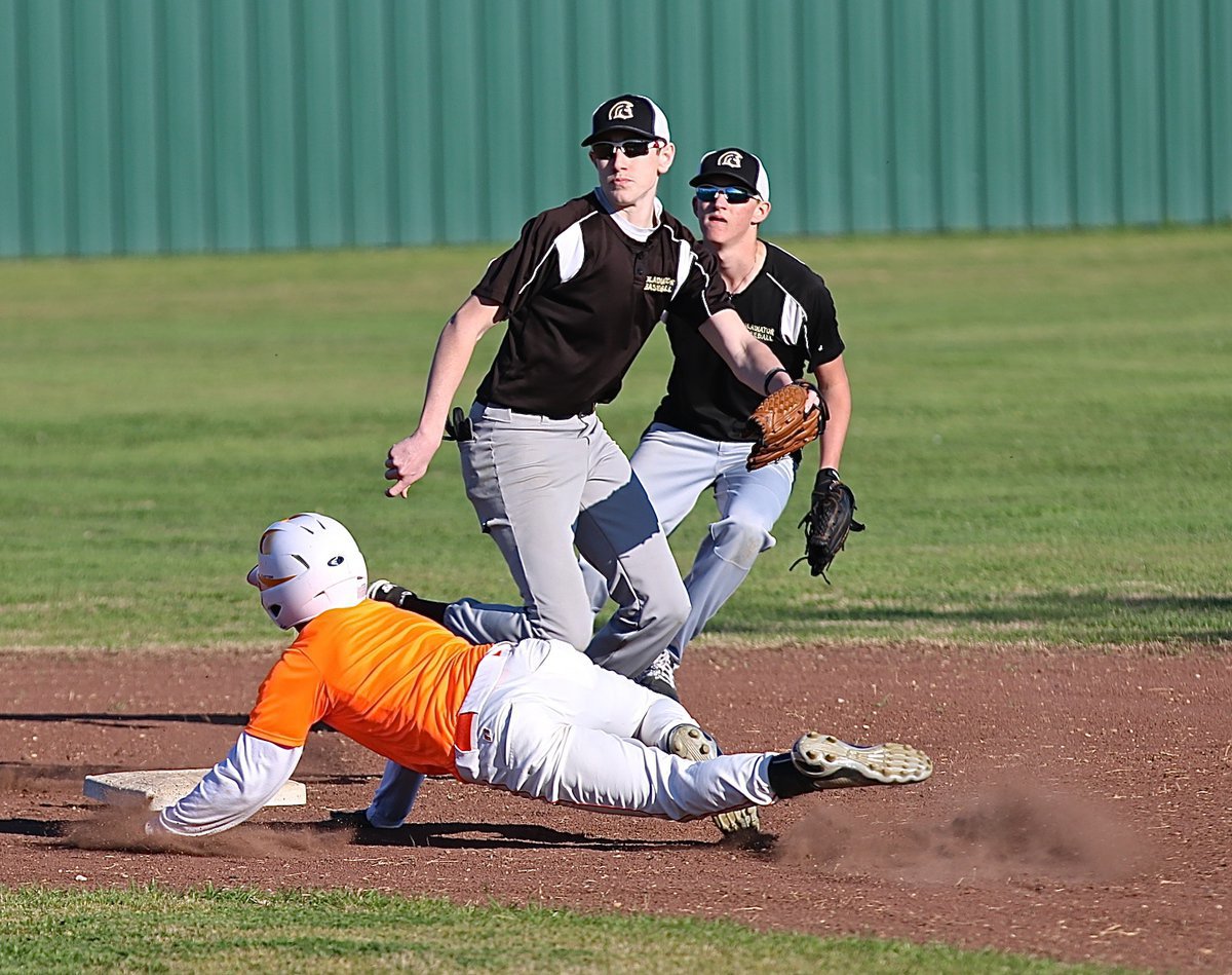 Image: Clayton Miller is on the receiving end of a throw down attempt with teammate Hunter Ballard backing up the throw.