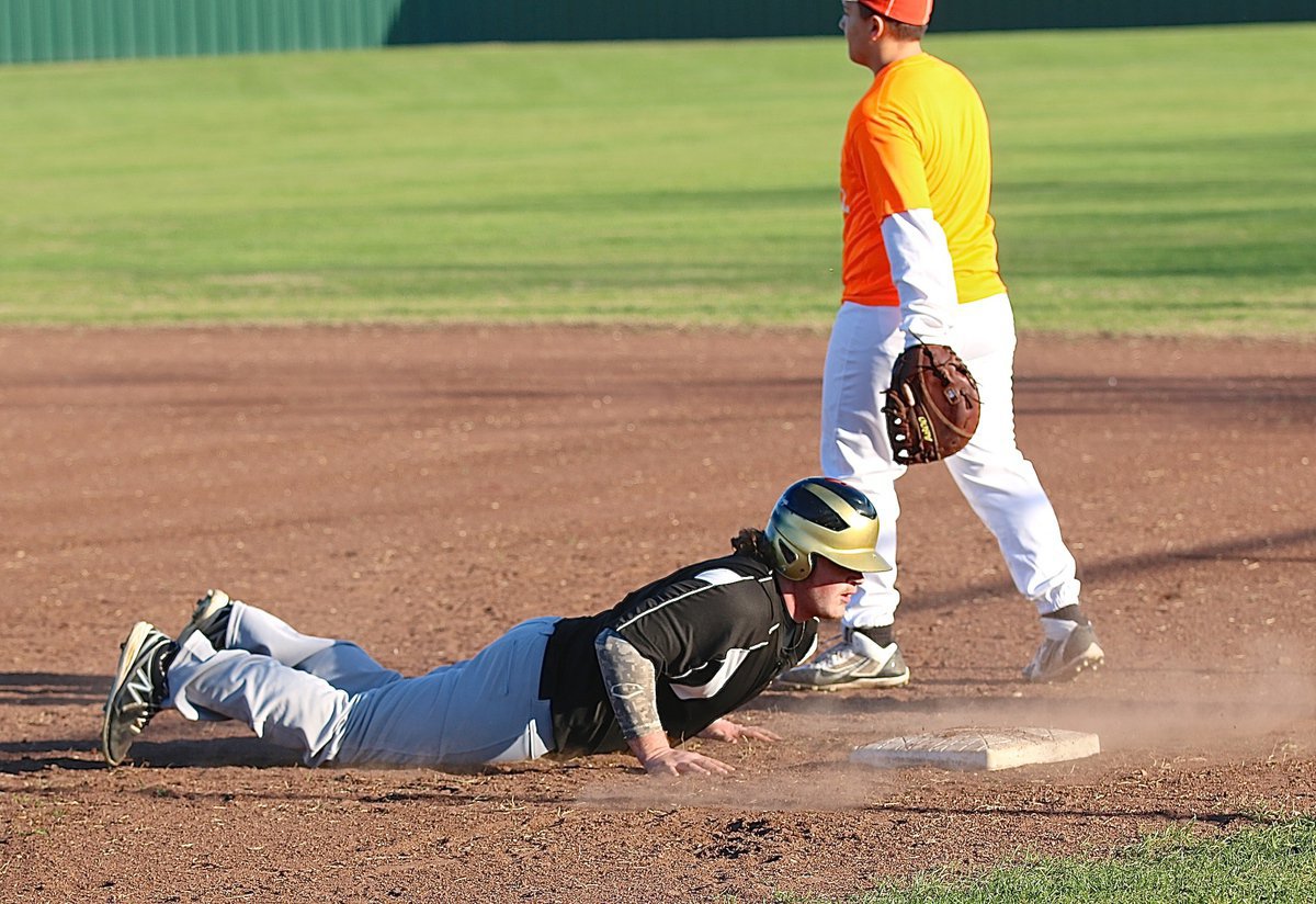 Image: Italy’s Tyler Vencill asks, “Who moved the base?” Vencill struggles to swim back to the first-base bag and shares a chuckle with his teammates.