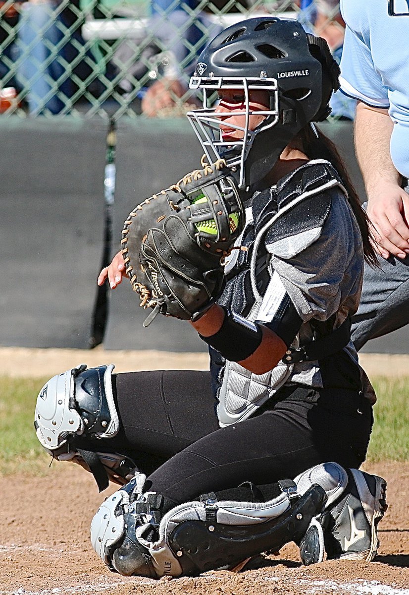 Image: Italy catcher April Lusk(7) clasps a strike from her pitcher, Jaclynn Lewis.