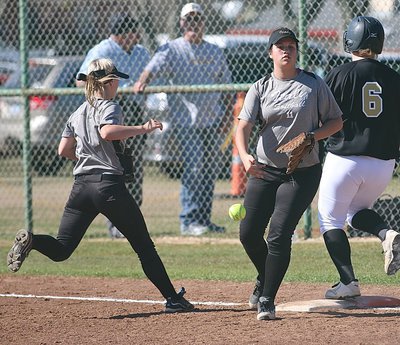 Image: Second-baseman Bailey Eubank(1) backed up teammate Jenna Holden(11) to ensure the Palmer runner was out at first.