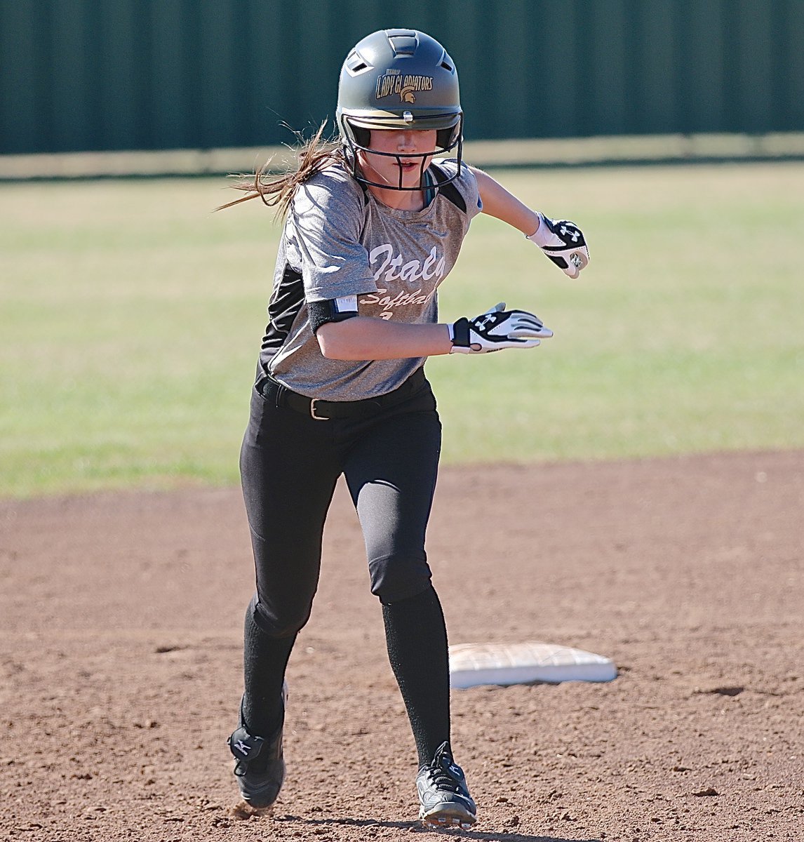 Image: Lady Gladiator Cassidy Childers(3) takes off for third-base.