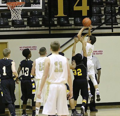 Image: JV Gladiator Gary Escamilla(2) puts up a shot from the block.