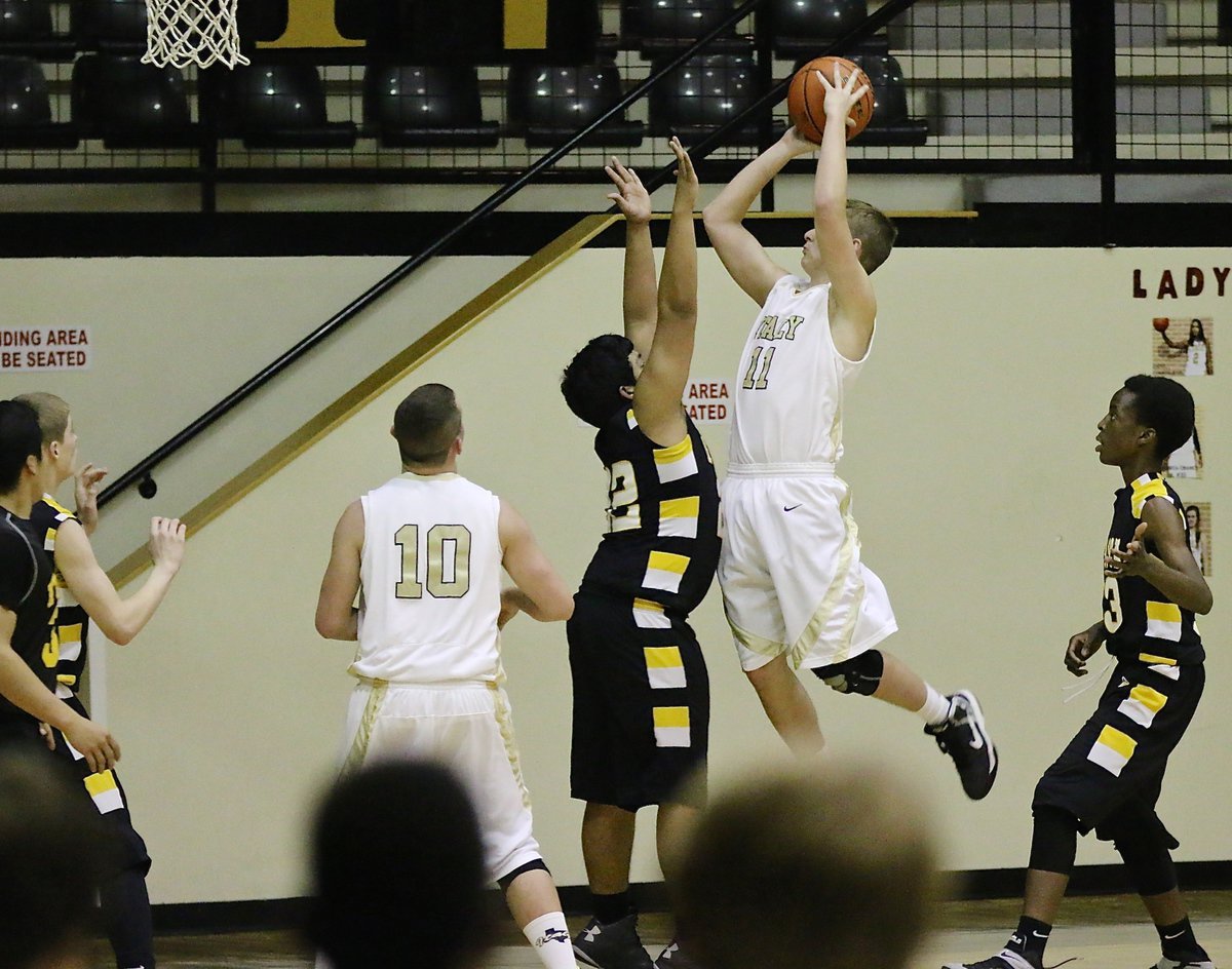 Image: James Walton(11) leans in against Itasca’s defense to put up a shot for Italy’s JV.