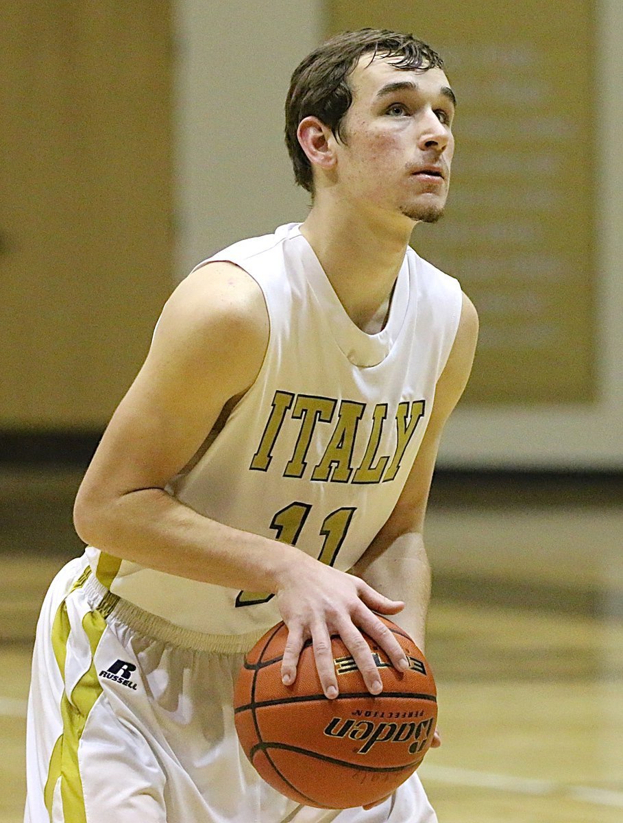 Image: Italy’s Ryan Connor(11) puts in a free-throw and finished the game with 5-points.