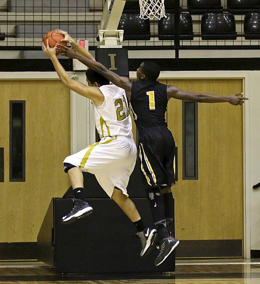 Image: Gladiator big man David De La Hoya(21) tears down a rebound.