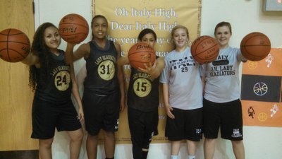 Image: Here, the same girls are ready to begin practice for an area playoff game against Santo.  Pictured (from left): Vanessa Cantu (sophomore), Emily Cunningham (freshman), Alex Minton (senior), Brycelen Richards (freshman), and Lillie Perry (junior).