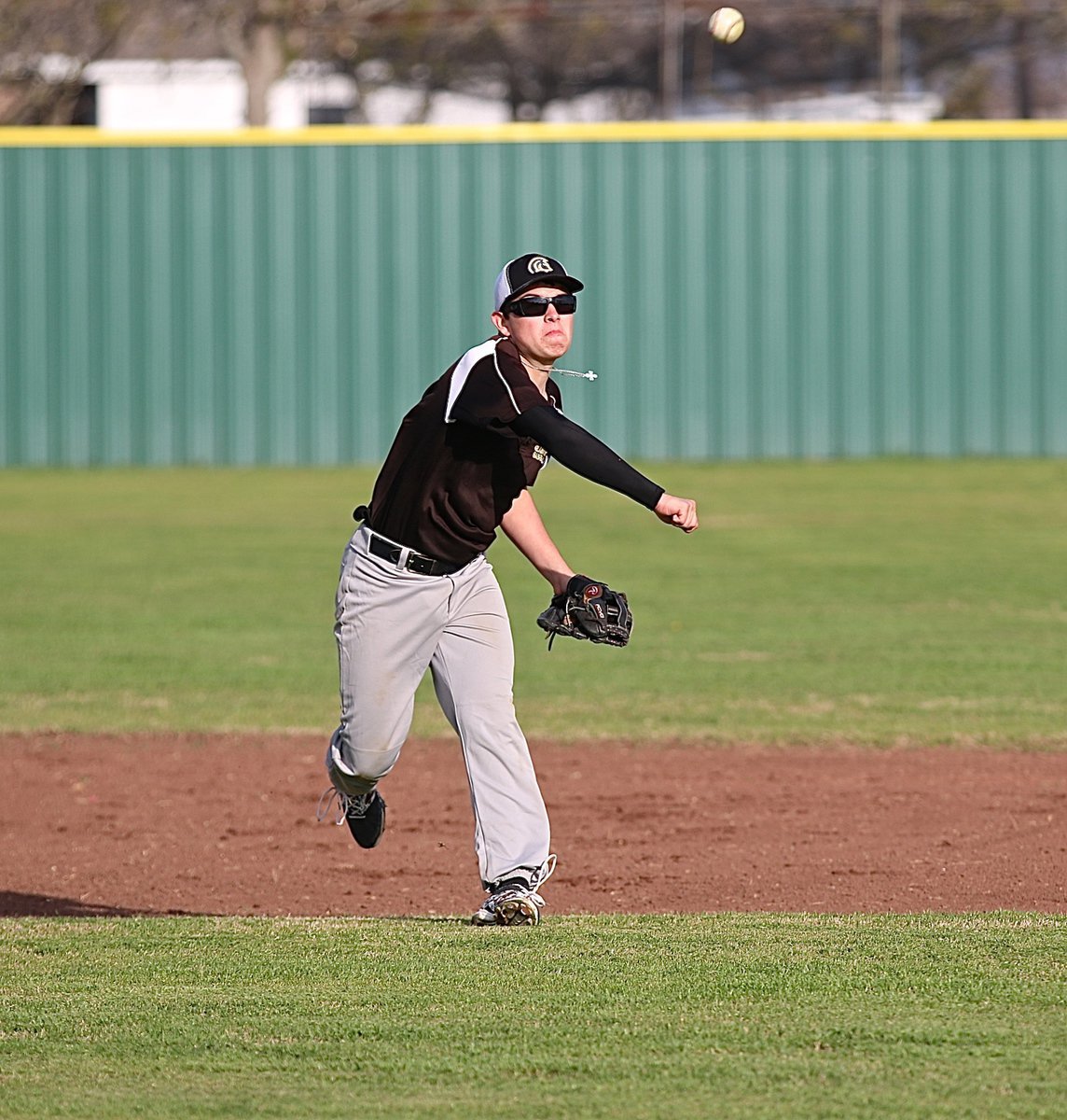 Image: Eli Garcia warms up at shortstop before the start of a scrimmage between Italy and Leon.