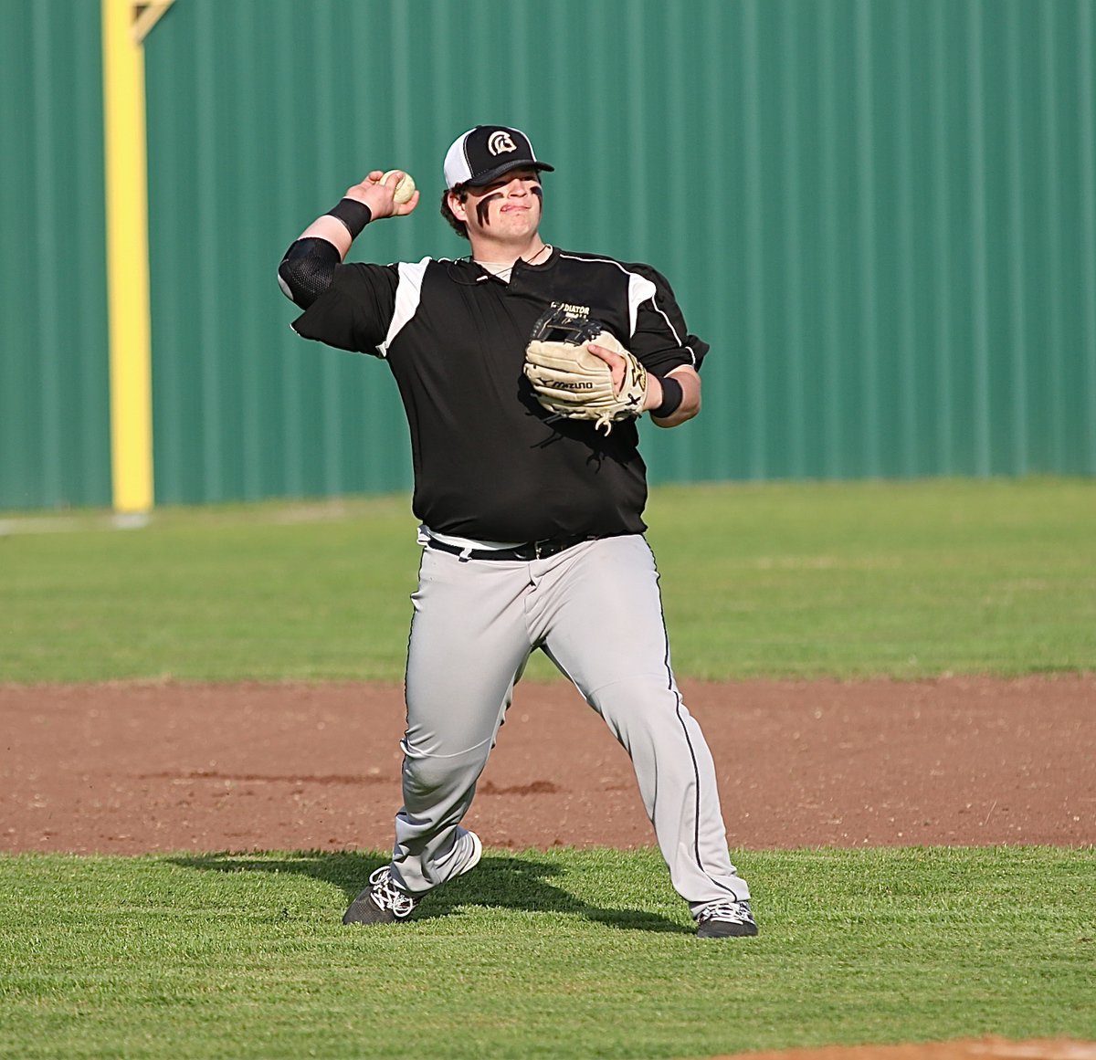 Image: John Byers readies at third-base to start the scrimmage against visiting Leon.