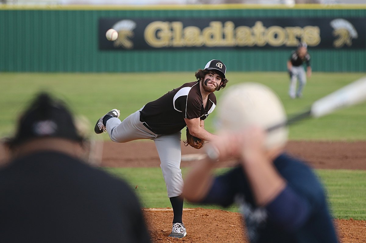 Image: Italy pitcher Kyle Fortenberry starts off with the heat against Leon’s first batter.